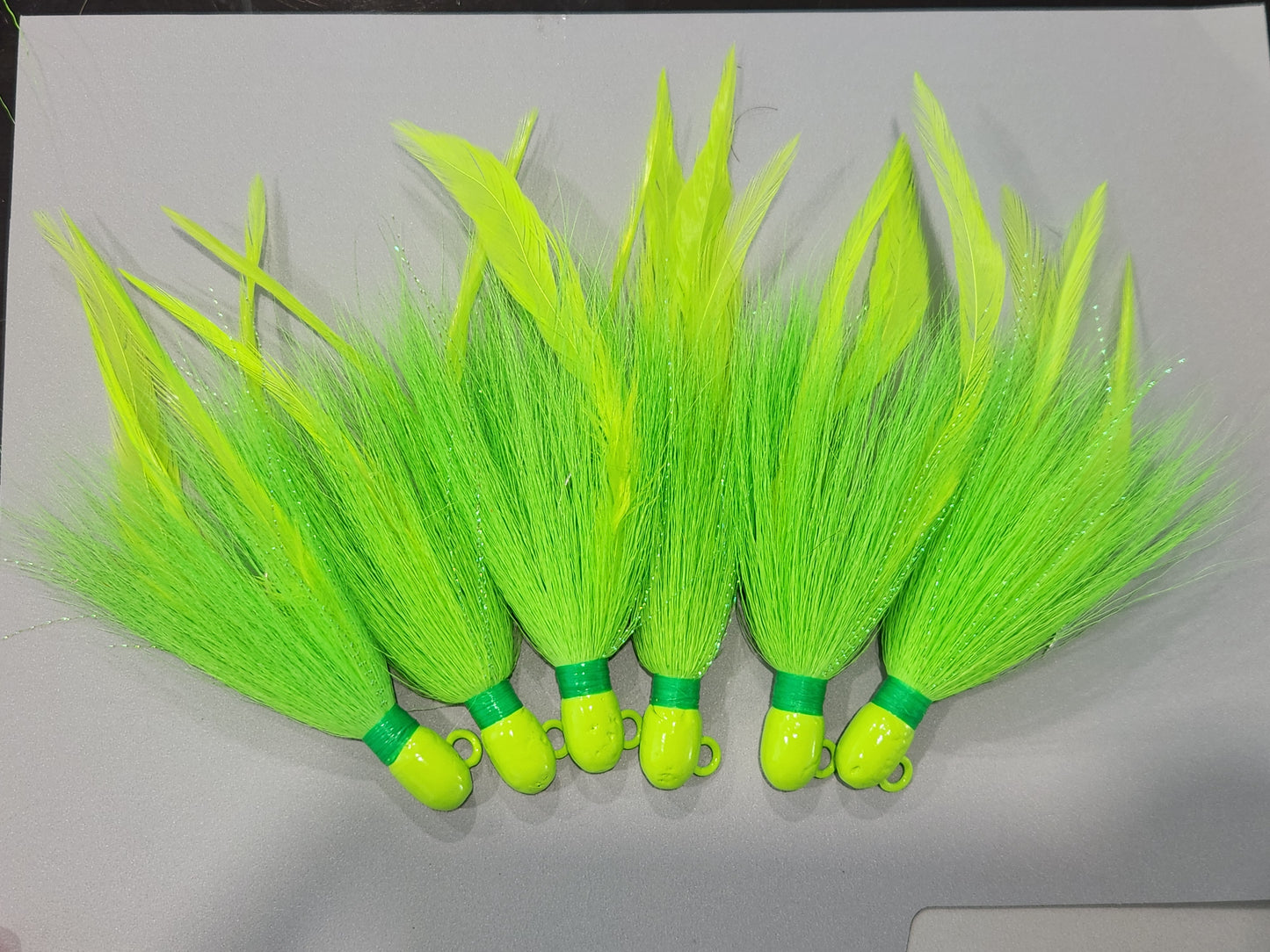 Green bucktail jig custom with feathers and flash 1/2oz to 3oz