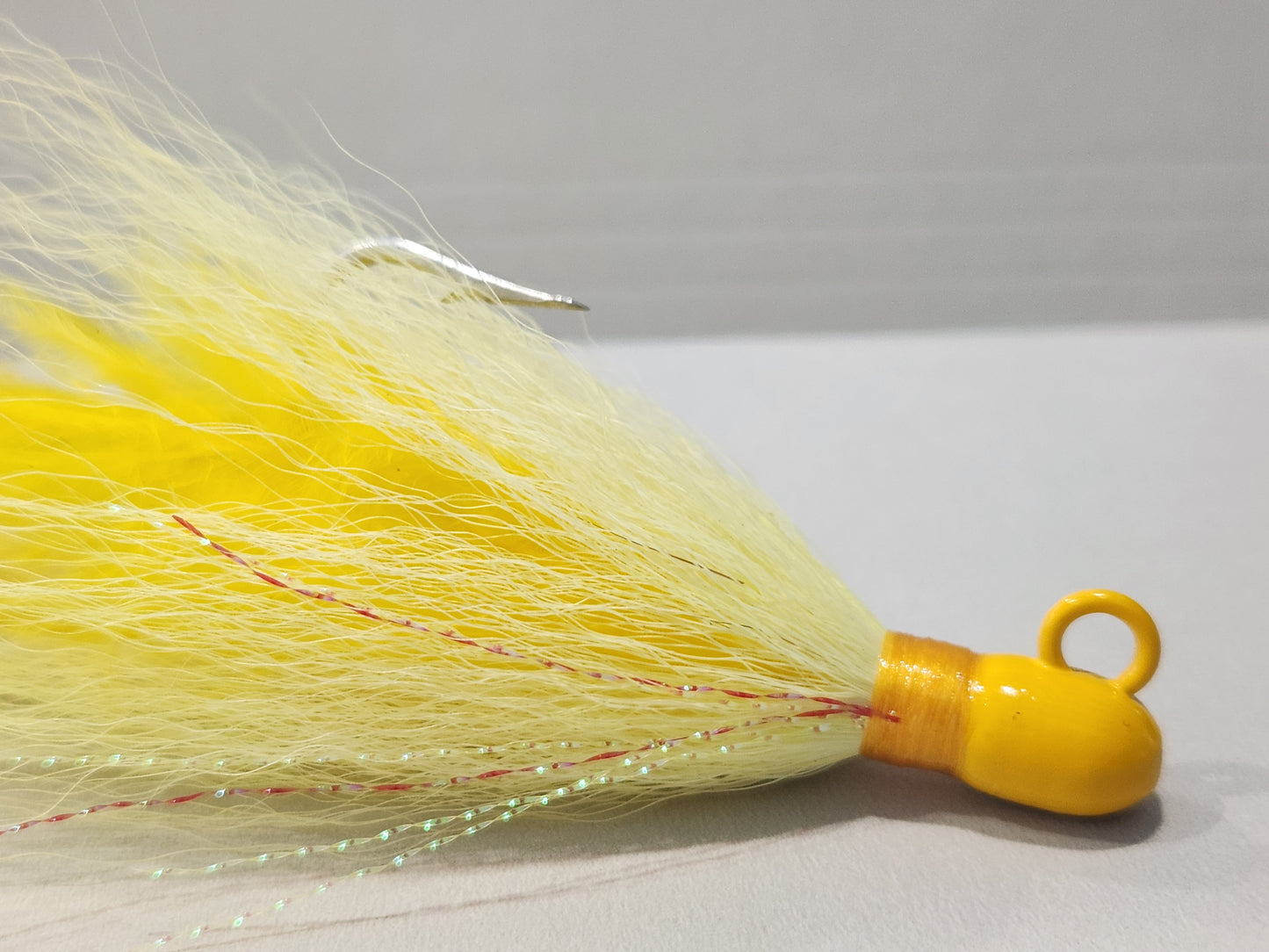 yellow custom bucktail on bullet jig